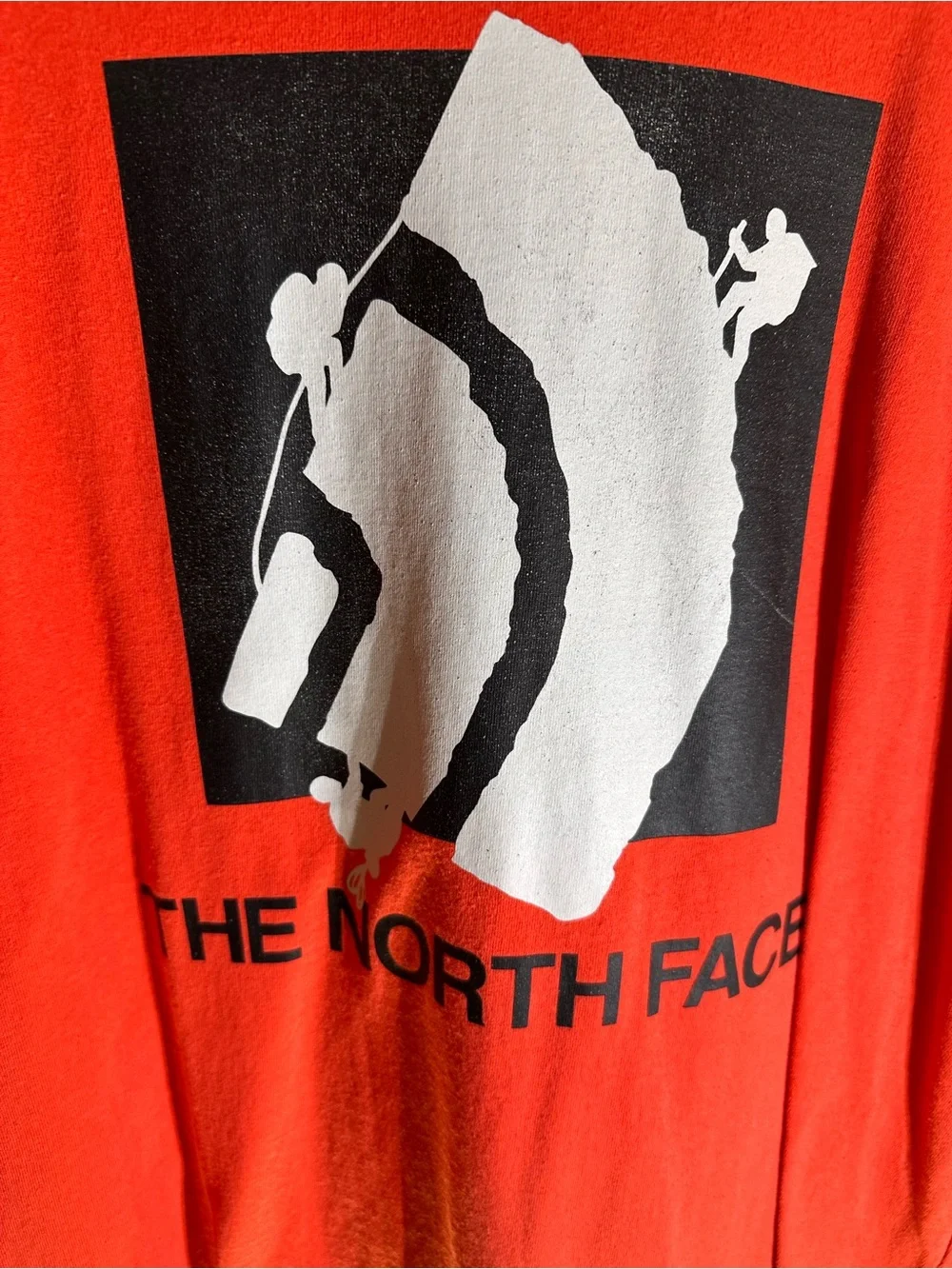 The North Face Red T‑Shirt with Black & White Mountain Climber Graphic